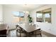 Bright dining room with wood table and chairs, neutral decor at 16780 W Cameron Dr, Surprise, AZ 85388