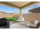 Covered patio with seating area and built in grill at 16780 W Cameron Dr, Surprise, AZ 85388