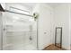 Clean shower with glass enclosure and built-in shelving at 16780 W Cameron Dr, Surprise, AZ 85388