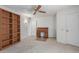 Bedroom with built-in shelves and ceiling fan at 17251 N Del Webb Blvd, Sun City, AZ 85373