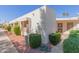 View of a light beige house showing multiple units and landscaping at 17251 N Del Webb Blvd, Sun City, AZ 85373