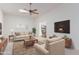 Living room with contemporary furniture and view to dining area at 17251 N Del Webb Blvd, Sun City, AZ 85373