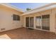 Spacious tiled patio with sliding glass doors and awning at 17251 N Del Webb Blvd, Sun City, AZ 85373