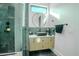 Elegant bathroom with dark marble tile and a sleek floating vanity at 18145 W Rancho Dr, Litchfield Park, AZ 85340