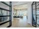 Bright and spacious entryway with modern glass doors and a view into the living room at 18145 W Rancho Dr, Litchfield Park, AZ 85340