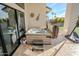 Relaxing hot tub on the patio, with views of the yard at 18145 W Rancho Dr, Litchfield Park, AZ 85340