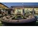 Expansive patio with circular seating and fire pit at 18145 W Rancho Dr, Litchfield Park, AZ 85340