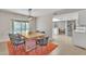 Dining area with wood table, woven chairs, and orange rug at 1819 W Evans Dr, Phoenix, AZ 85023