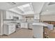 Spacious kitchen with skylights and white cabinetry at 1819 W Evans Dr, Phoenix, AZ 85023