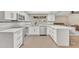 Modern white kitchen with quartz countertops and island at 1819 W Evans Dr, Phoenix, AZ 85023