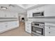 Modern kitchen with stainless steel appliances and white cabinets at 1819 W Evans Dr, Phoenix, AZ 85023