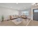 Living room with two sofas, a rug, and large windows at 1819 W Evans Dr, Phoenix, AZ 85023