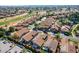 Aerial view of community featuring homes and a golf course at 19111 N 94Th Ave, Peoria, AZ 85382