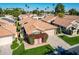 Single-story home with solar panels and lush landscaping at 19111 N 94Th Ave, Peoria, AZ 85382