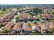 Aerial view of community, showcasing homes with solar panels at 19111 N 94Th Ave, Peoria, AZ 85382