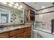 Bathroom with granite vanity and walk-in shower at 19111 N 94Th Ave, Peoria, AZ 85382