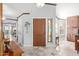 Entryway with stained glass, wood door, and view to living room at 19111 N 94Th Ave, Peoria, AZ 85382