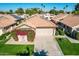 Aerial view of a tan house with a tile roof and landscaping at 19111 N 94Th Ave, Peoria, AZ 85382