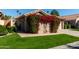 House exterior with lush bougainvillea and a walkway at 19111 N 94Th Ave, Peoria, AZ 85382