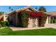 Charming home exterior with vibrant bougainvillea at 19111 N 94Th Ave, Peoria, AZ 85382