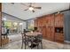 Home office with built-in wooden wall unit, desk, and seating area at 19111 N 94Th Ave, Peoria, AZ 85382