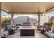 Relaxing patio with fire pit and comfortable seating at 19111 N 94Th Ave, Peoria, AZ 85382