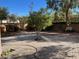 Landscaped backyard with paved patio and mature trees at 20391 E Via Del Oro Dr, Queen Creek, AZ 85142