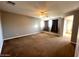 Bright bedroom featuring carpet, ceiling fan and window coverings at 20391 E Via Del Oro Dr, Queen Creek, AZ 85142