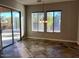 Bright dining room with sliding glass doors leading to backyard at 20391 E Via Del Oro Dr, Queen Creek, AZ 85142