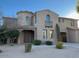 Two-story house with arched entryway and balcony at 20391 E Via Del Oro Dr, Queen Creek, AZ 85142