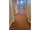 Upper level hallway with carpeted floors and access to bedrooms at 20391 E Via Del Oro Dr, Queen Creek, AZ 85142