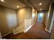 Upper level hallway with carpeted floors and access to bedrooms at 20391 E Via Del Oro Dr, Queen Creek, AZ 85142