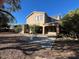 Two-story house with stucco exterior and large backyard at 20391 E Via Del Oro Dr, Queen Creek, AZ 85142