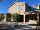 Two-story house with stucco exterior and covered patio at 20391 E Via Del Oro Dr, Queen Creek, AZ 85142