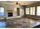 Spacious living room with tile flooring and a cozy fireplace at 20391 E Via Del Oro Dr, Queen Creek, AZ 85142