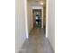 Bright hallway with tile flooring leading to other rooms at 20496 W Valley View Dr, Buckeye, AZ 85396