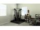 Bright home gym with weight machine and floor mat at 20496 W Valley View Dr, Buckeye, AZ 85396