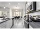 Modern kitchen featuring stainless steel appliances, sleek countertops, and stylish cabinets at 20496 W Valley View Dr, Buckeye, AZ 85396