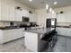 Modern kitchen with white cabinets, island, and stainless steel appliances at 20496 W Valley View Dr, Buckeye, AZ 85396