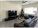 Spacious living room with large TV and comfortable seating at 20496 W Valley View Dr, Buckeye, AZ 85396