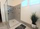 Walk-in shower with modern gray tile and glass door at 20496 W Valley View Dr, Buckeye, AZ 85396