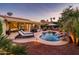 Escape to your own backyard oasis with a pool, patio, and fire pit at 22012 N Arrellaga Dr, Sun City West, AZ 85375