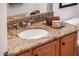 Bathroom vanity with single sink and granite countertop at 22012 N Arrellaga Dr, Sun City West, AZ 85375