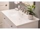 White bathroom vanity with single sink and modern faucet at 22012 N Arrellaga Dr, Sun City West, AZ 85375