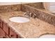 Bathroom vanity with double sinks and granite countertop at 22012 N Arrellaga Dr, Sun City West, AZ 85375