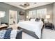 Main bedroom with gray walls and a king-size bed at 22012 N Arrellaga Dr, Sun City West, AZ 85375