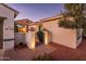 Welcoming courtyard entry featuring a brick walkway and wrought iron gate at 22012 N Arrellaga Dr, Sun City West, AZ 85375