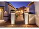 Charming courtyard entry with an iron gate and brick pavers at 22012 N Arrellaga Dr, Sun City West, AZ 85375