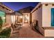 Charming courtyard entry with seating and a rustic bench at 22012 N Arrellaga Dr, Sun City West, AZ 85375