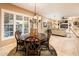 Bright dining area with wood table and chairs, view into living room at 22012 N Arrellaga Dr, Sun City West, AZ 85375